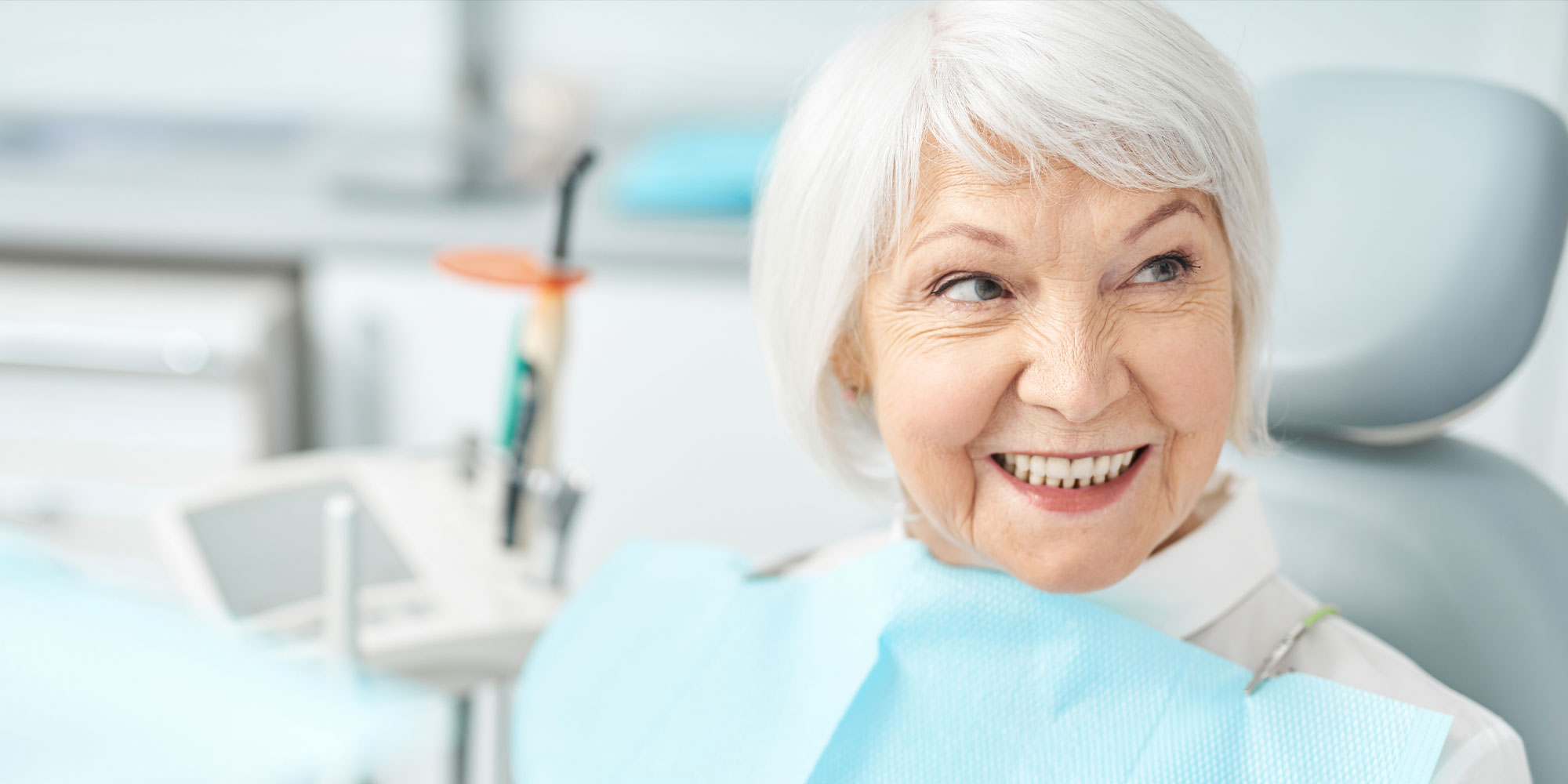 dental patient missing teeth discussing options implants